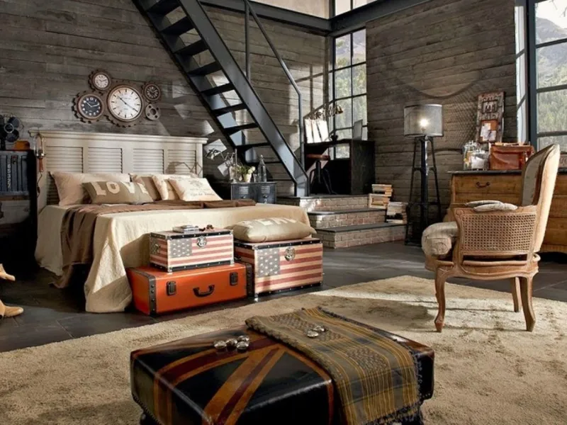 Una comoda poltrona d'altri tempi non deve mancare in una camera da letto stile industriale