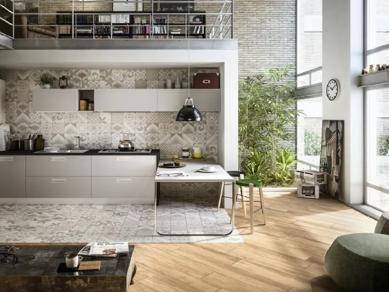 Un openspace targato Iperceramica, tutto in gres, effetto parquet e cementina