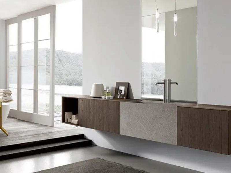 Linea More di Modulnova con mobile in rovere e lavabo in pietra piasentina