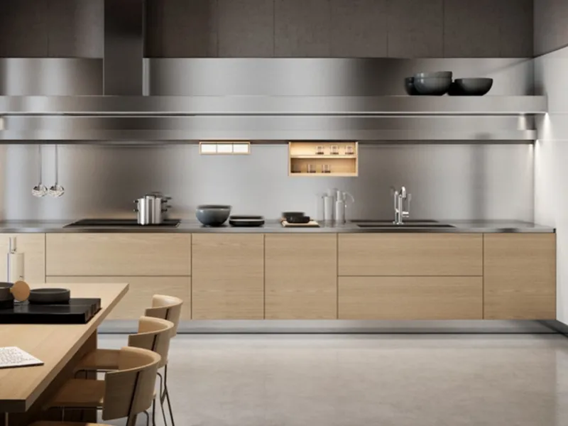 Cucina Gamma di Arclinea con paraschizzi in acciaio