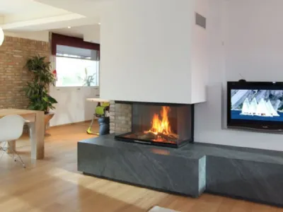 Parete attrezzata con caminetto monoblocco Spartherm a convenzione naturale, a legna di Michelin Caminetti