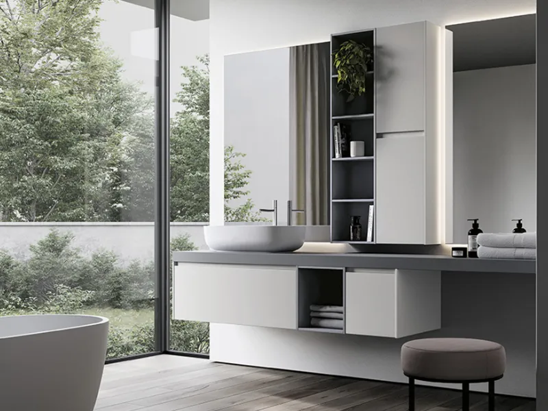 Essenziale e leggera composizione realizzata nella finitura Fenix Bianco Kos e Fenix Grigio Antrim